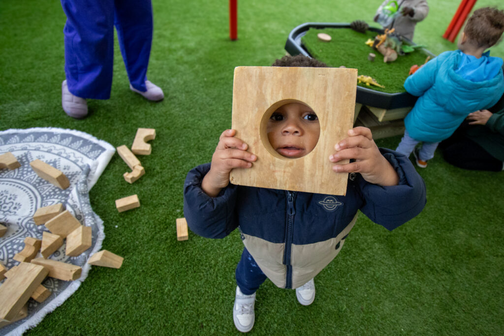 Playing with wooden blocks at LEYF Cumberland Nursery