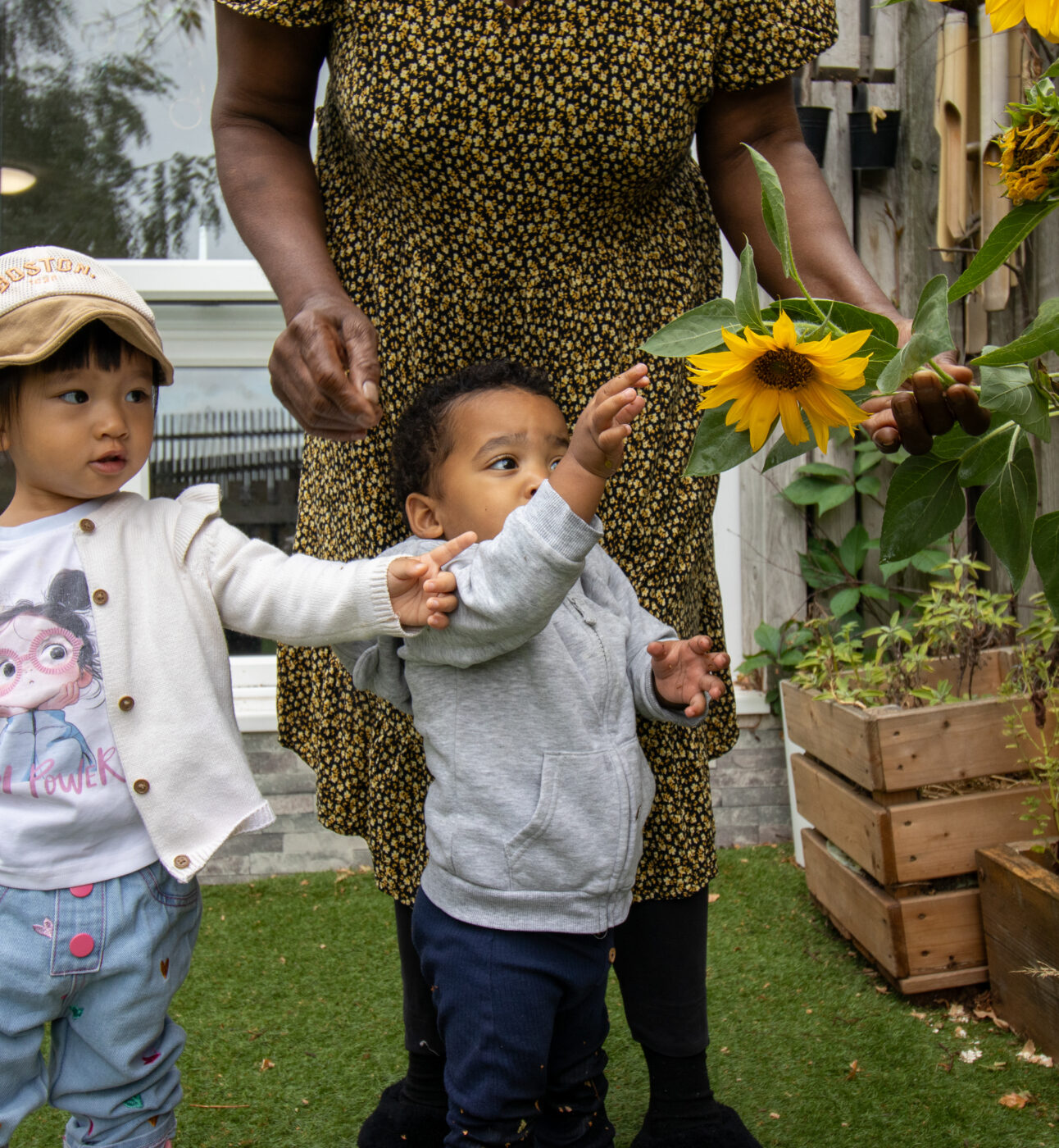 Children exploring flower