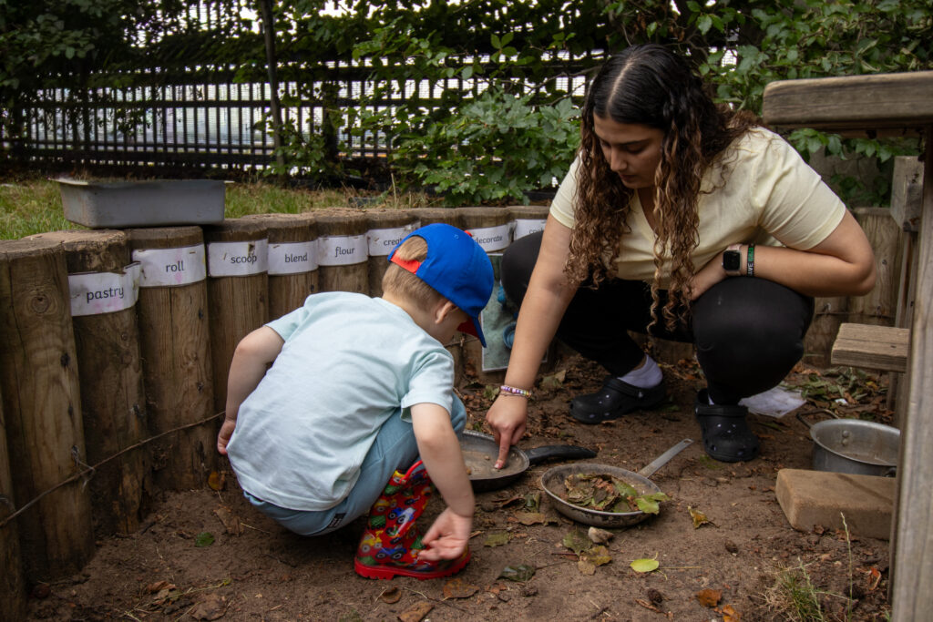 Playing in the sand at Children's Garden Nursery