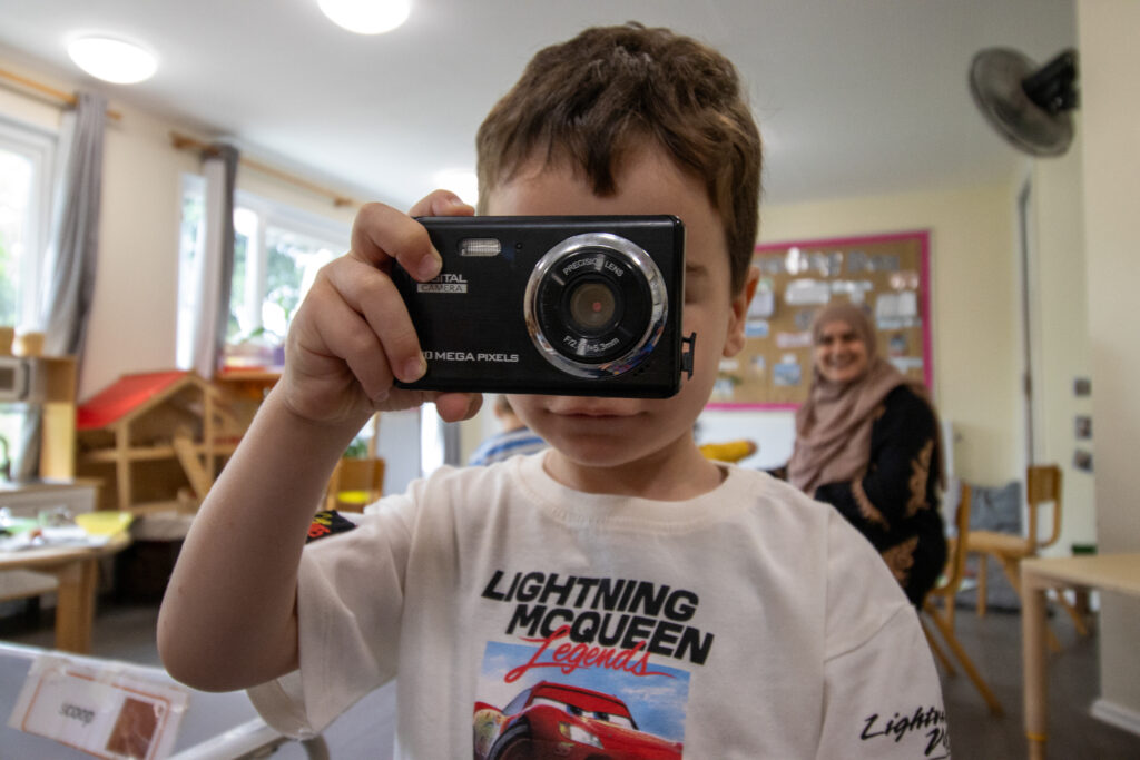 Learning to use a camera at LEYF Children's Garden Nursery