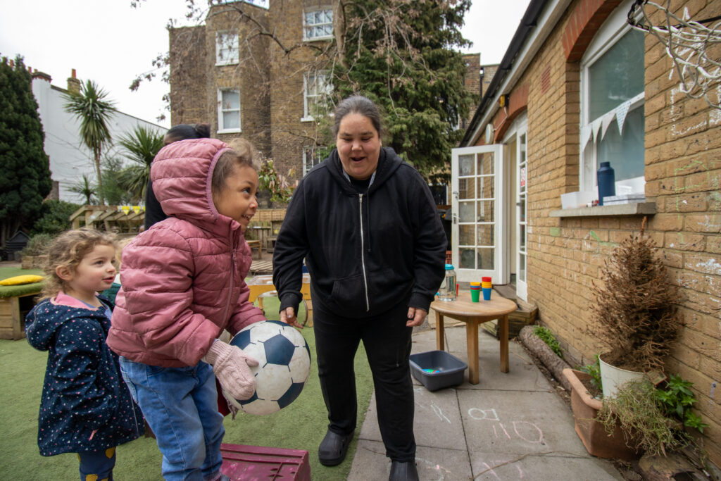 Playing outside with a ball at LEYF Stockwell Gardens