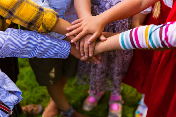 Children holding their hands together
