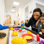 Playing with giant lego at LEYF Royal Oak Nursery