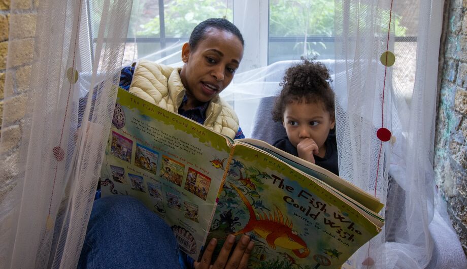 Enjoying a book together at Angel Pre-School